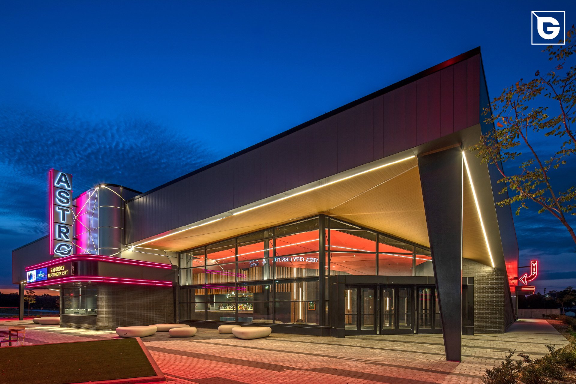 Geolam wood-effect composite soffit — Astro City Centre at night