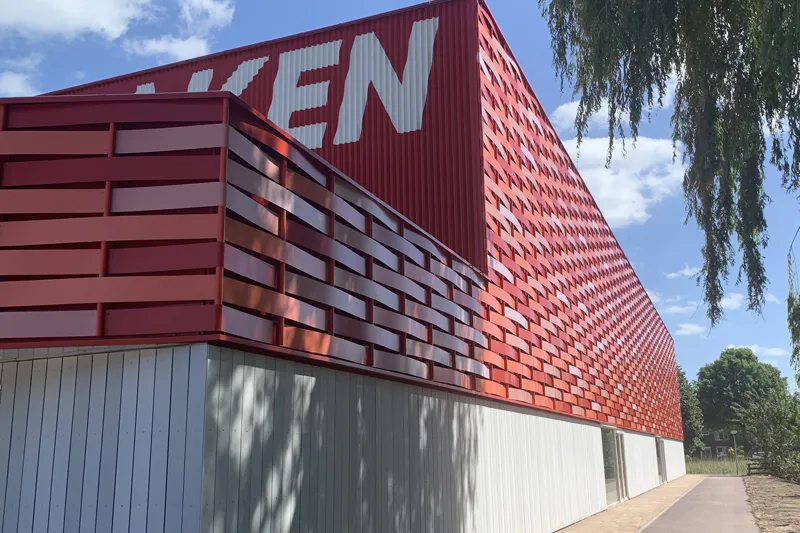Petrarch engineered stone cladding — Het Blaken red facade, Netherlands