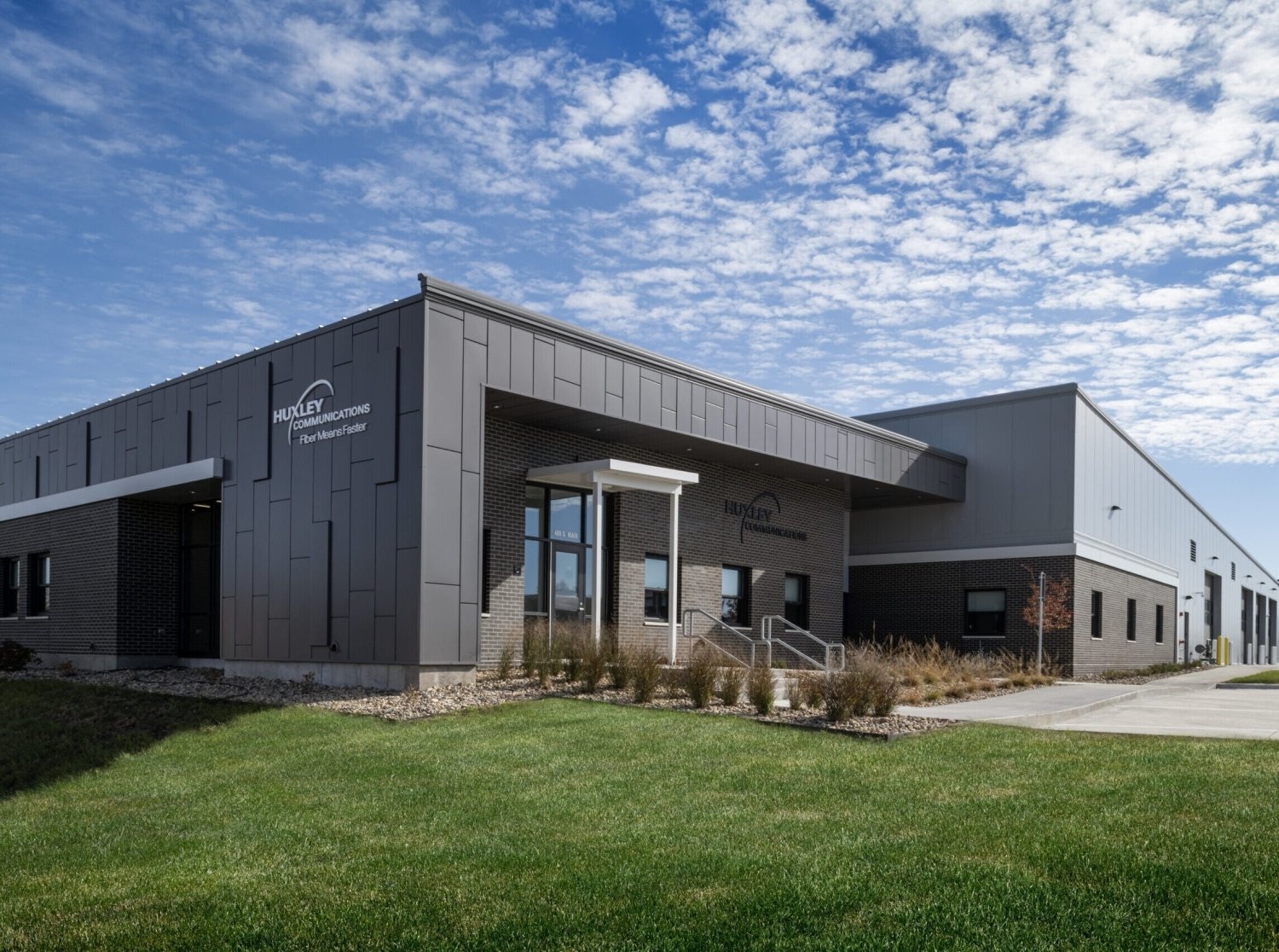 CLADLOK™ panels — Huxley Communications building with grey metal facade